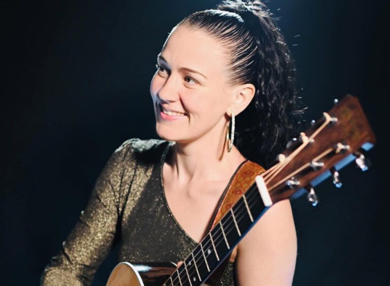Laura Wyatt performing live acoustic music during wedding ceremony in France